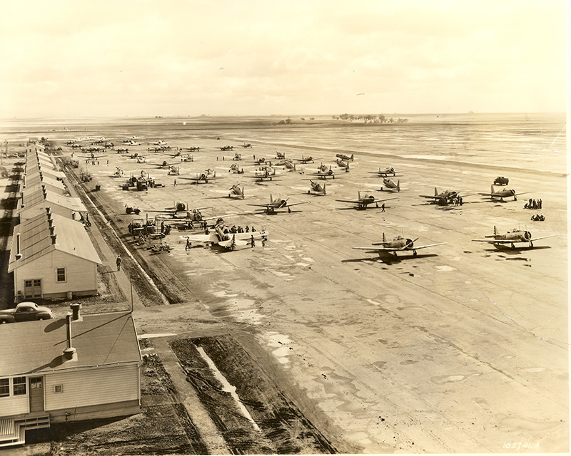 an old black and white photo of an airfield