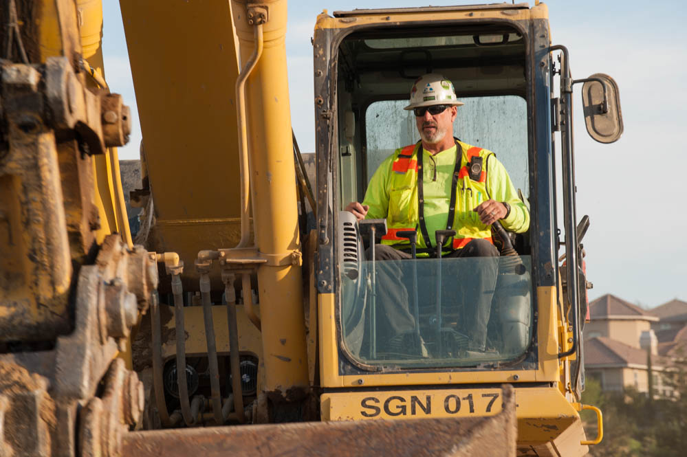 an image of a Teichert employee on a backhoe